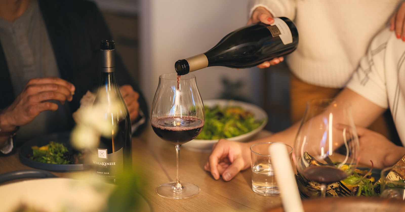 A bowl of chicken marsala and a bottle of WillaKenzie Pinot Noir